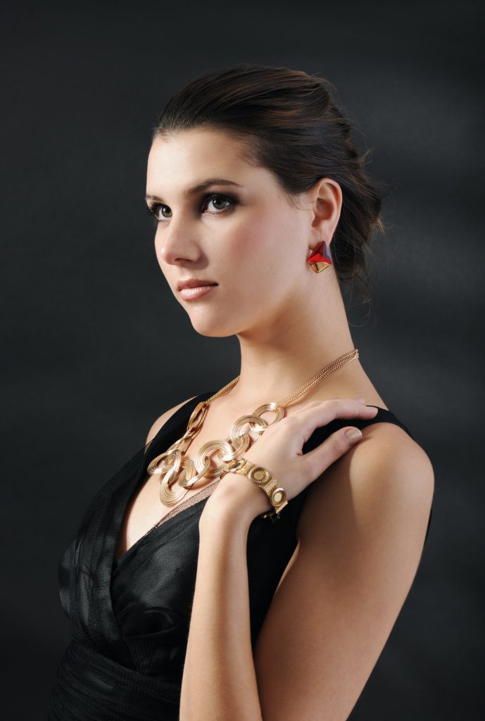 beautiful woman in golden jewelry
